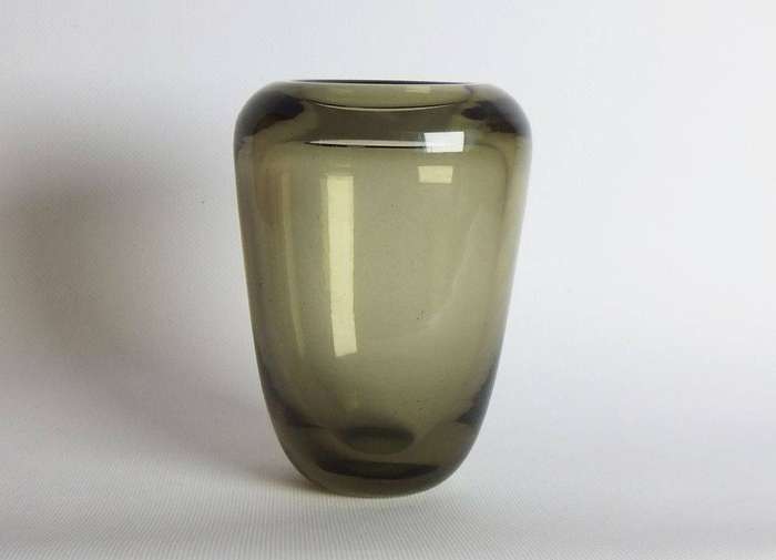 A heavy vintage Holmegaard style glass vase with polished base