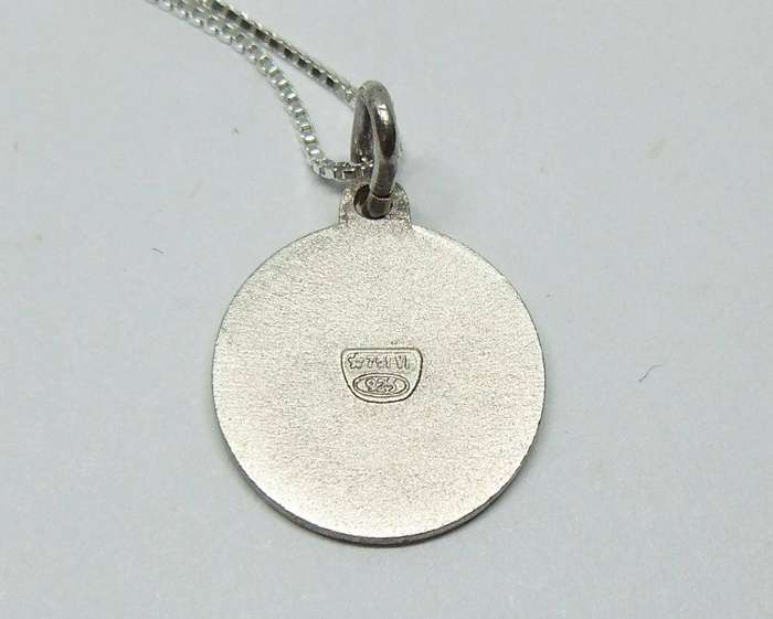A vintage sterling silver Cancer Zodiac sign pendant with a sterling silver necklace