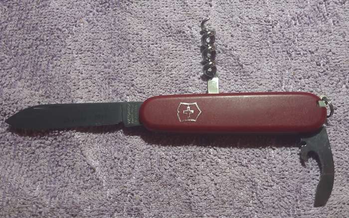 Victorinox - Recruit with Red Nylon Scales condition and tools as per pictures