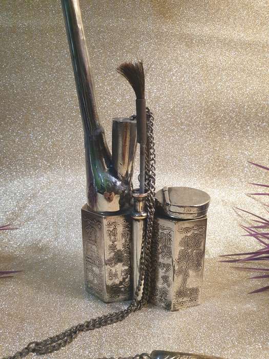 A Chinese white metal opium pipe