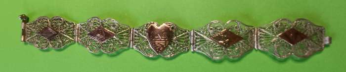 Vintage silver filigree and copper link bracelet  | 33 |