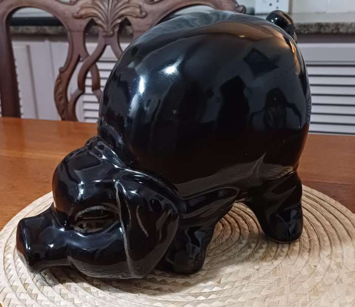 Large Black Porcelain piggy bank representing a pig and dating from the 1980s.