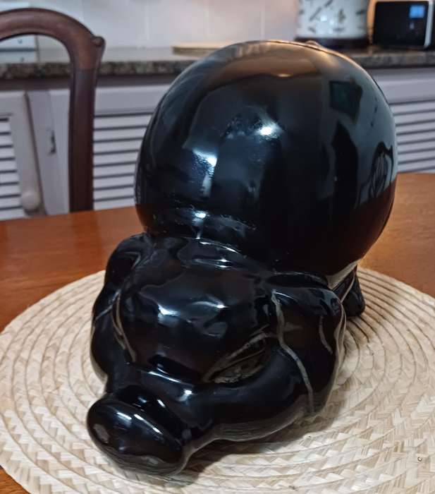 Large Black Porcelain piggy bank representing a pig and dating from the 1980s.