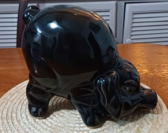 Large Black Porcelain piggy bank representing a pig and dating from the 1980s.