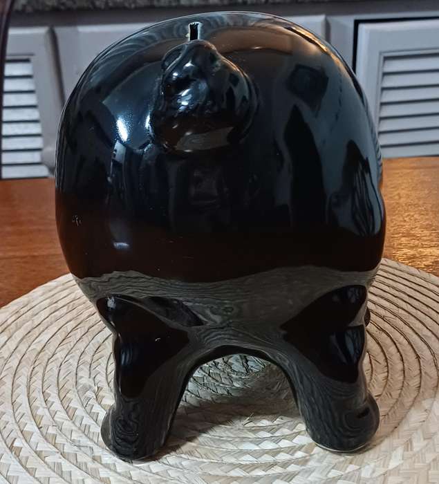 Large Black Porcelain piggy bank representing a pig and dating from the 1980s.