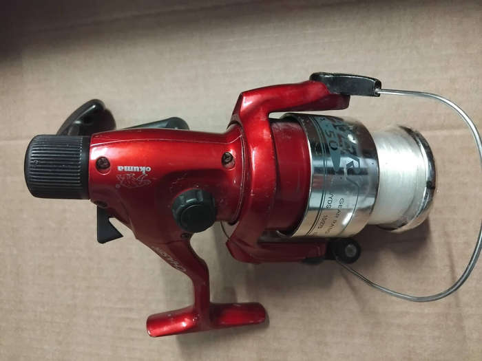 FISHING REEL: OKUMA CHASER AX-50 SPINNING FISHING REEL.