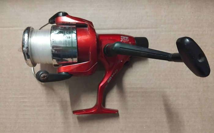 FISHING REEL: OKUMA CHASER AX-50 SPINNING FISHING REEL.