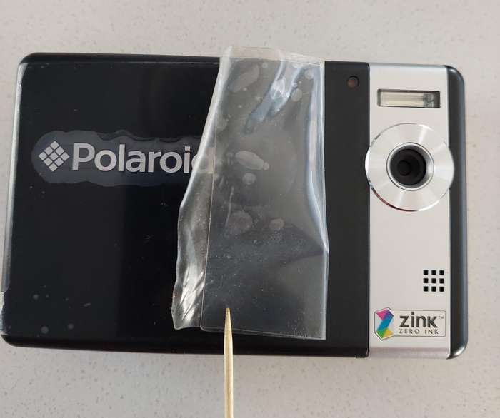 Poloroid Pogo instant digital camera (LIKE NEW) still has plastics on the camera.