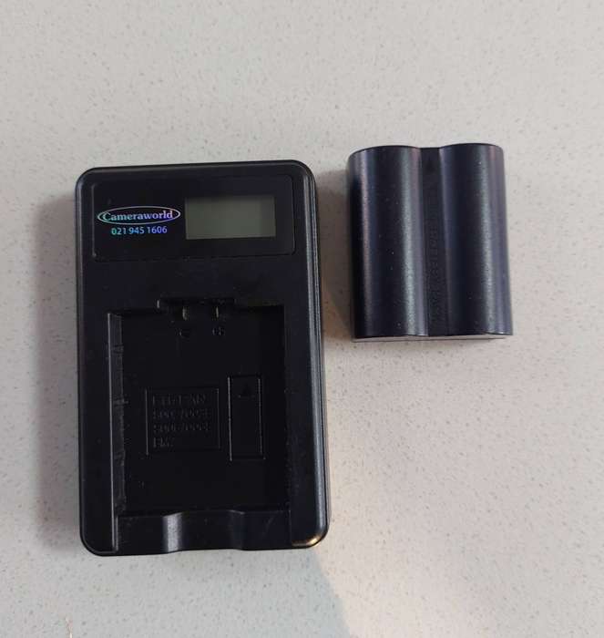 Panasonic CGR-S006E battery and charger. In good working condition.