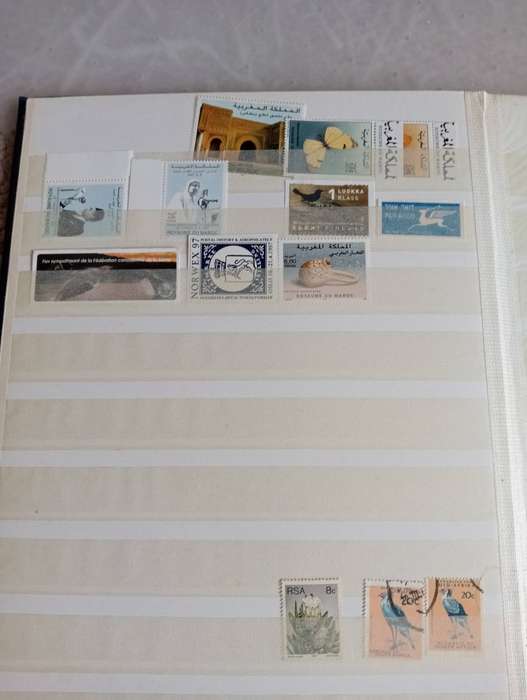 STOCK BOOK with a mix-some useful mint/used.SCARCE GERMAN LABEL'S included !!!