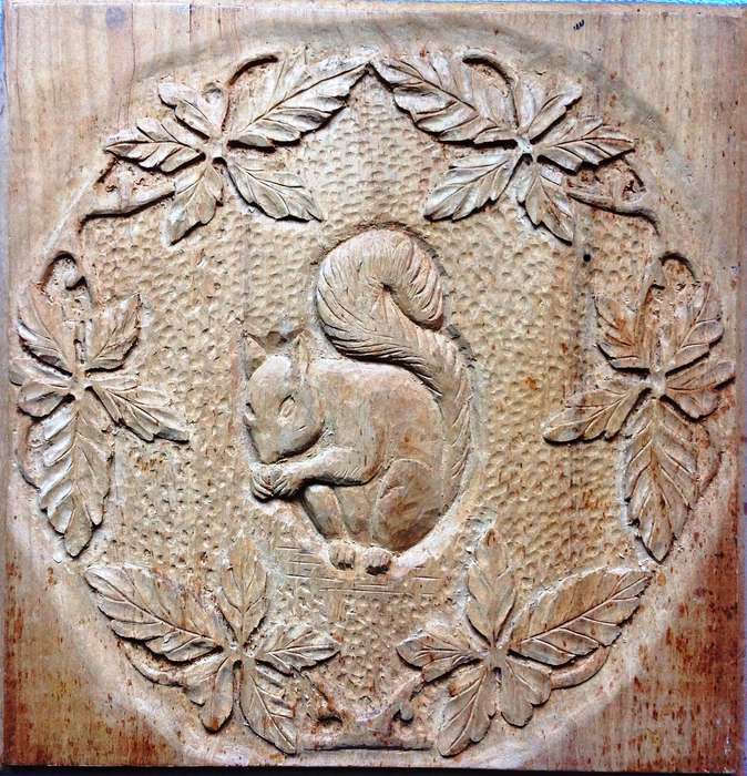 Carved Squirrel and Oak Leaves on Yellow Wood