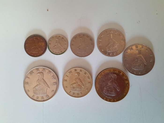 Zimbabwean Coins - 1 Cent, 5 Cents, 10 Cents, 20 Cents, 50 Cents, 1 Dollar, 2 Dollar and 5 Dollar.