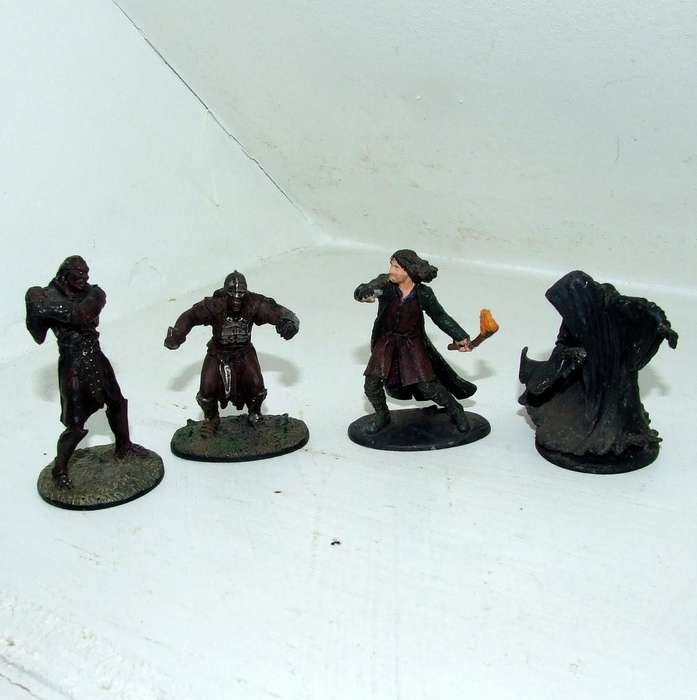Four played with LORD OF THE RINGS figurines