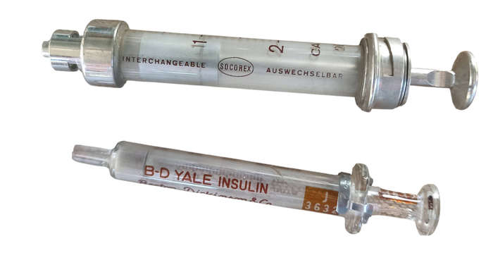 2 Vintage glass and metal syringes with 9 needles in metal box