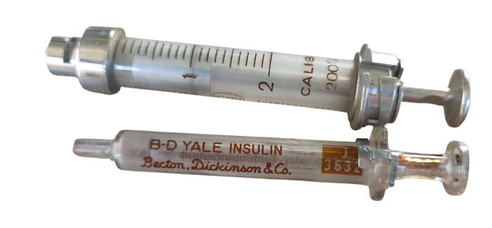 2 Vintage glass and metal syringes with 9 needles in metal box