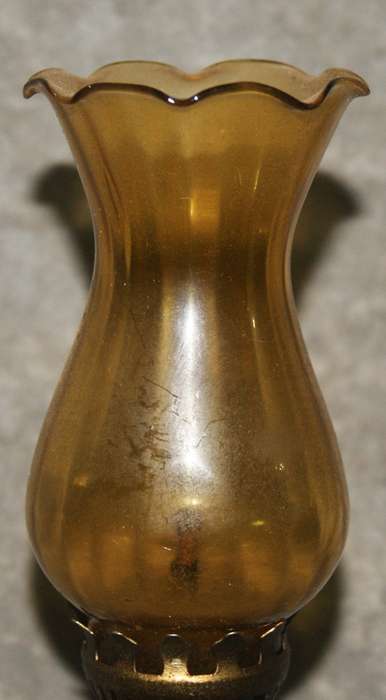 Vintage oil lamp with amber glass flue