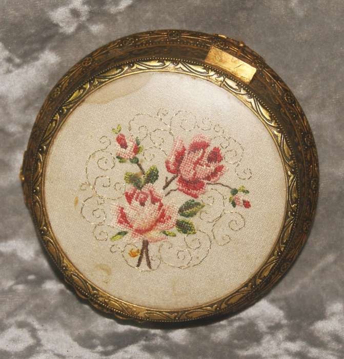 Brass footed high relief trinket box with needlepoint on lid