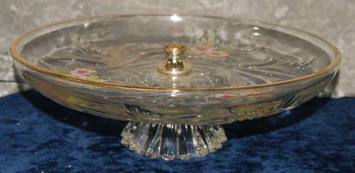 Molded glass pastry serving dish on central column with signed artwork on top