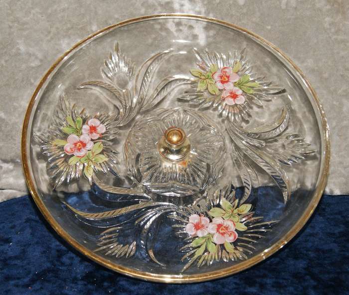 Molded glass pastry serving dish on central column with signed artwork on top