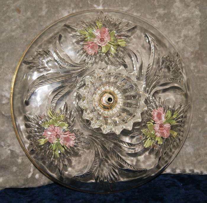 Molded glass pastry serving dish on central column with signed artwork on top