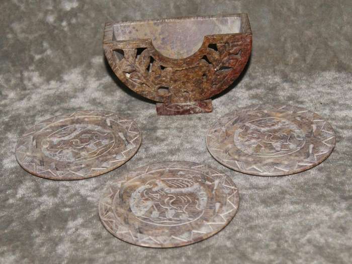 Set of 3 hand carved stone coasters in holder