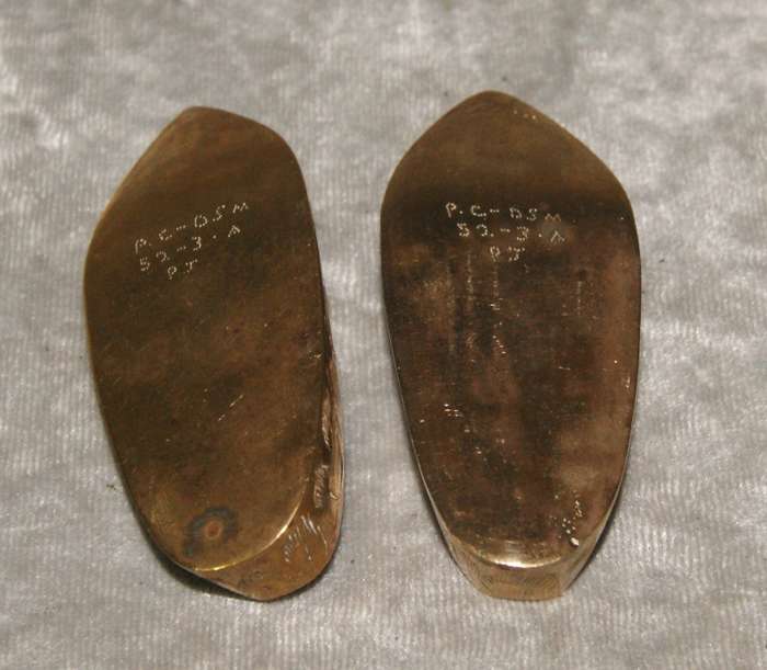 Pair of vintage brass etched shoes