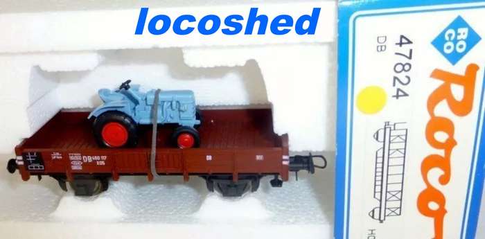H0 gge 1/87 83mm DB low-sided wagon loaded w. Fahr Tractor, mint in orig.box Roco 47824