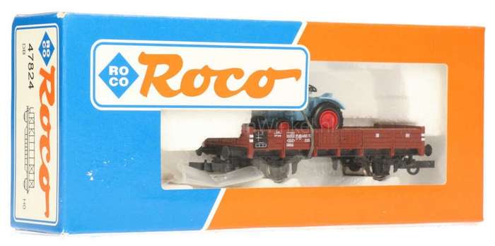 H0 gge 1/87 83mm DB low-sided wagon loaded w. Fahr Tractor, mint in orig.box Roco 47824