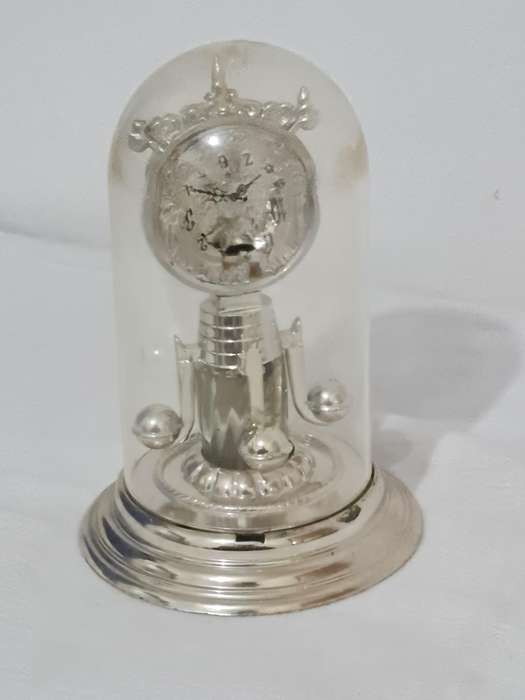 Clock that is not a clock. Small scent bottle inside.  Bottle no lid. Dial damage