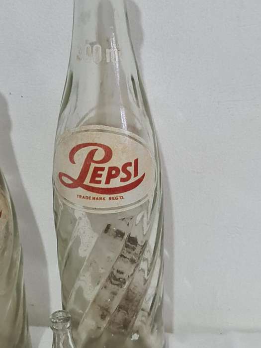 X4 Differant size and age Pepsi Cola bottles.