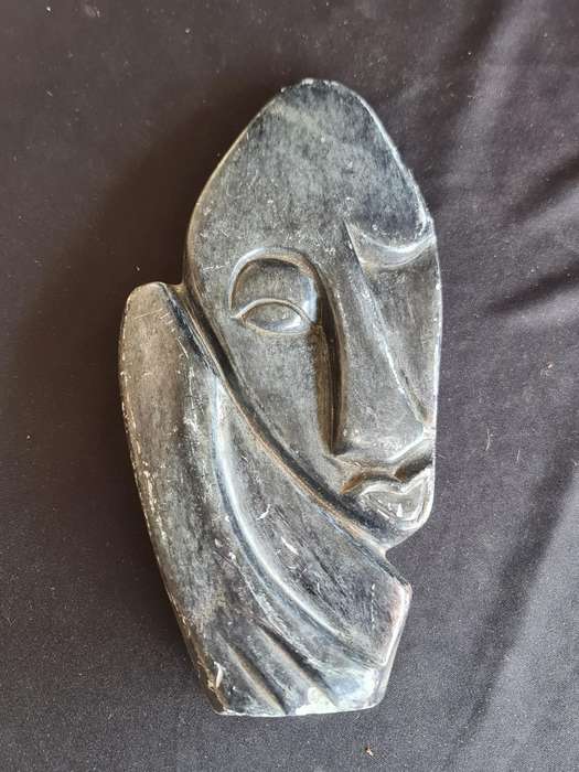 Soap stone carved face