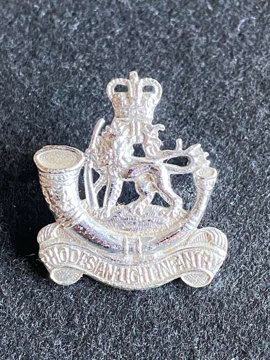 RHODESIA LIGHT INFANTRY ANODISED CAP BADGE-WORN 1964-72- 2 LUGS