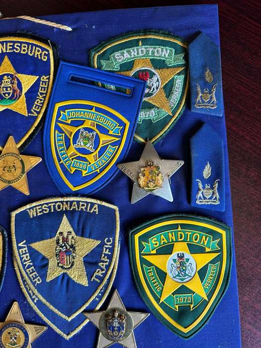 Large selection of traffic police badges and patches. Sold as one lot.