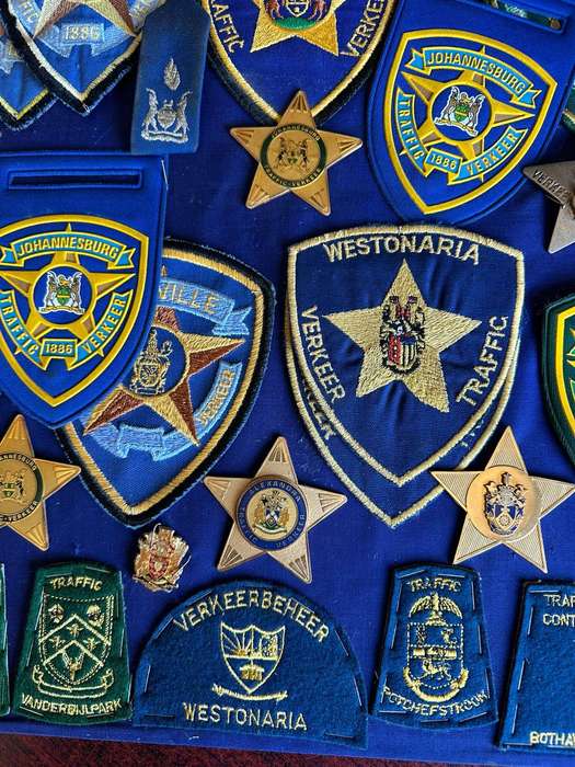 Large selection of traffic police badges and patches. Sold as one lot.