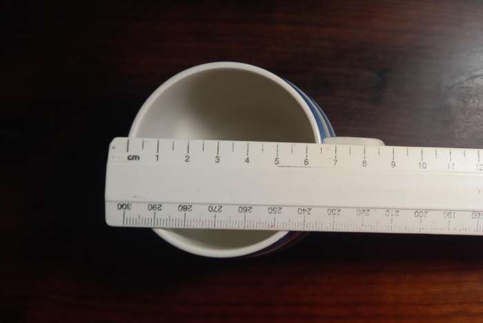 CORNISHWARE - KITCHEN WARE TEA CUP AND SAUCER
