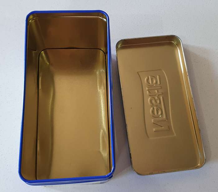 NESTLE tin as per photos