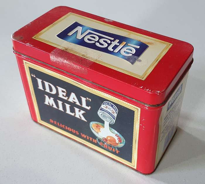 NESTLE tin as per photos