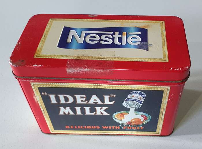 NESTLE tin as per photos
