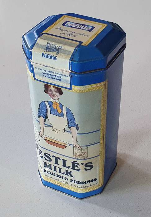 NESTLE tin as per photos