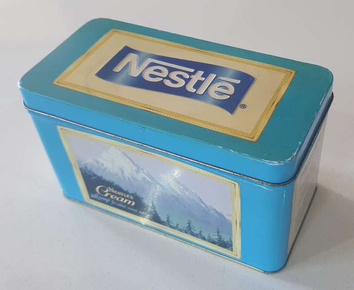 NESTLE tin as per photo