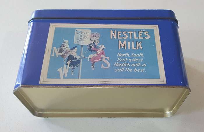 NESTLE tin as per photo