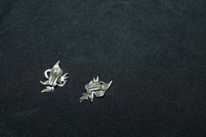 4 Marcasite Brooches and a pair of earrings
