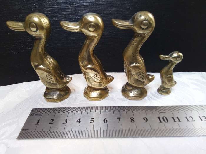 Cute family of vintage brass ducks