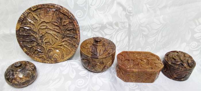 A lovely collection of vintage brown hand carved Soapstone trinket boxes