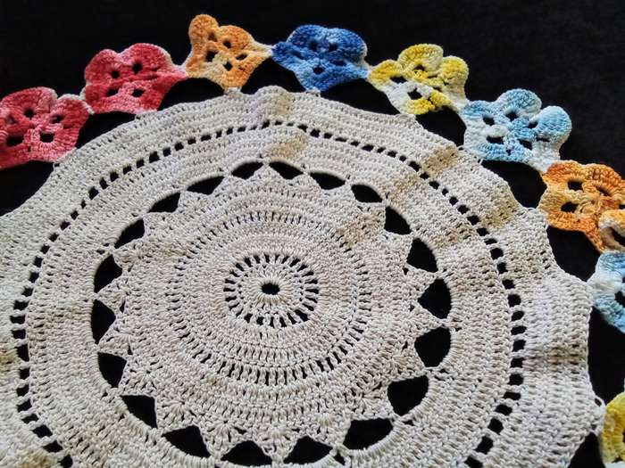 Cute vintage beige hand crocheted doily with flower detail