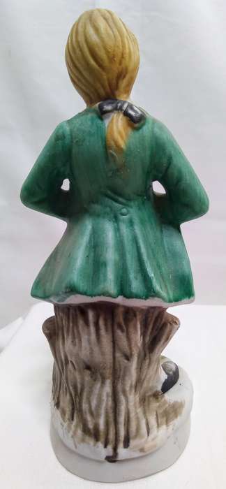 Boy playing accordian porcelain figurine