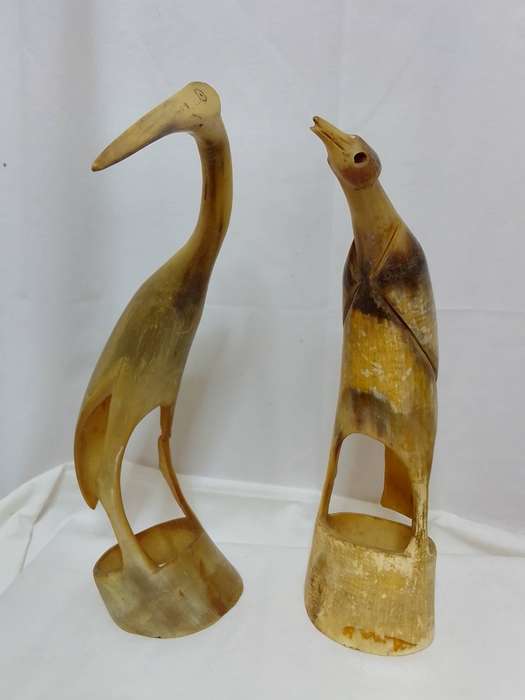 Two vintage carved horn birds