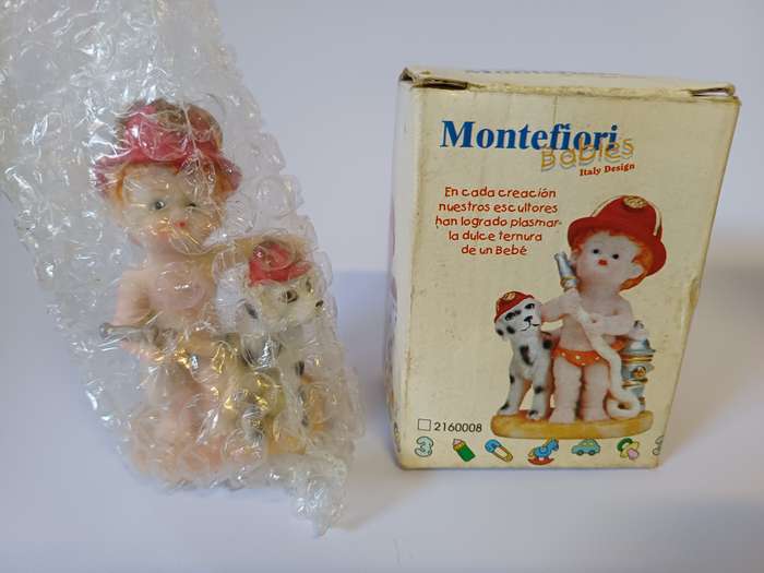 Montefiori Babies Figurine - Firefighter Baby with Dalmatian Dog