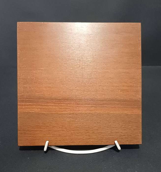Solid dark wood solitaire board with light wood pegs