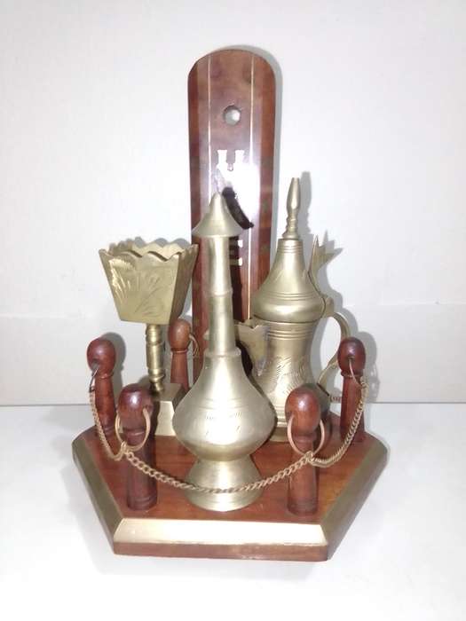Collection of incense burners on wooden stand